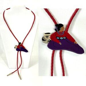 Hand painted and signed native woman bolo tie/brooch .